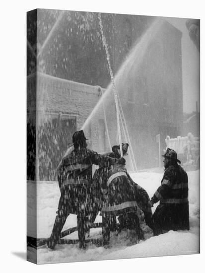 Firemen Fighting a Fire During Icy Weather-Al Fenn-Stretched Canvas