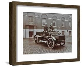 Firemen in Brass Helmets Aboard a Motor Hose Tender, London Fire Brigade Headquarters, London, 1909-null-Framed Photographic Print