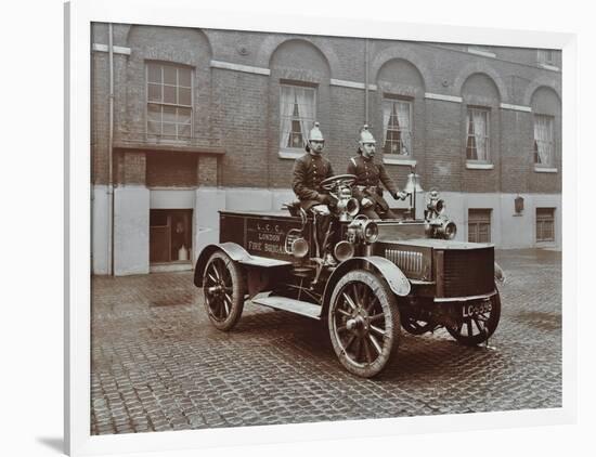 Firemen in Brass Helmets Aboard a Motor Hose Tender, London Fire Brigade Headquarters, London, 1909-null-Framed Photographic Print