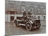 Firemen in Brass Helmets Aboard a Motor Hose Tender, London Fire Brigade Headquarters, London, 1909-null-Mounted Photographic Print