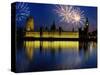 Fireworks exploding over the Houses of Parliament and the river Thames, London, England-null-Stretched Canvas