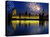 Fireworks exploding over the Houses of Parliament and the river Thames, London, England-null-Stretched Canvas