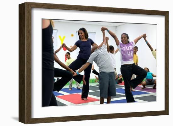 First Lady Michelle Obama Joins an after School 'Let's Move!' Yoga Class after School Activities-null-Framed Photo