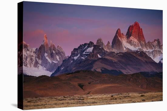 First Light Hits Cerro Torre and Mount Fitz Roy in Los Glacieres National Park, Argentina-Jay Goodrich-Stretched Canvas