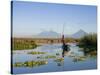 Fisherman, Agua and Pacaya Volcanoes in the Background, Monterrico, Pacific Coast, Guatemala-Michele Falzone-Stretched Canvas