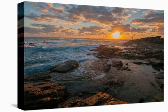 Fisherman fishing off rocks at sunrise, Queensland, Australia-Mark A Johnson-Stretched Canvas