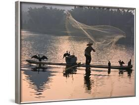 Fisherman Fishing with Cormorants on Bamboo Raft on Li River at Dusk, Yangshuo, Guangxi, China-Keren Su-Framed Photographic Print