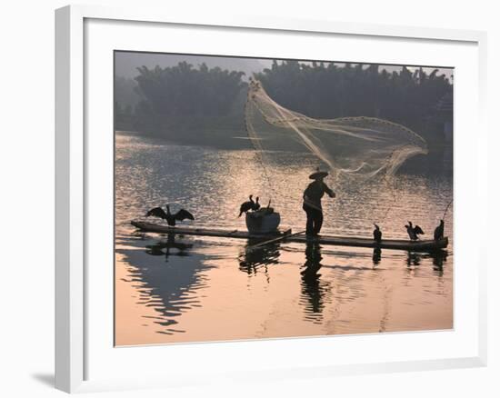 Fisherman Fishing with Cormorants on Bamboo Raft on Li River at Dusk, Yangshuo, Guangxi, China-Keren Su-Framed Photographic Print