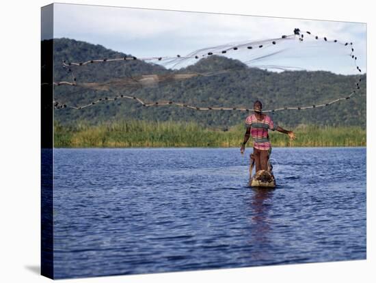 Fisherman in Dugout Canoe Casts Net in Shire River, Lake Malawi's Only Outlet, Southern End of Lake-Nigel Pavitt-Stretched Canvas