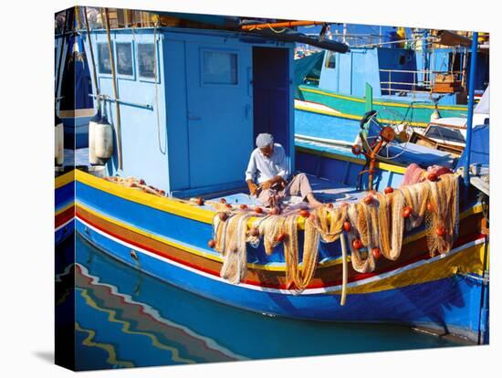 Fisherman Knotting a Fishing Net, Marsaxlokk, Malta, Mediterranean, Europe-Sakis Papadopoulos-Stretched Canvas