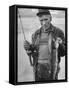 Fisherman Lauri Rapala, Who Handmakes Fishing Lures, with a Fish He Caught-null-Framed Stretched Canvas