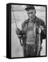 Fisherman Lauri Rapala, Who Handmakes Fishing Lures, with a Fish He Caught-null-Framed Stretched Canvas