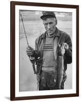 Fisherman Lauri Rapala, Who Handmakes Fishing Lures, with a Fish He Caught-null-Framed Photographic Print