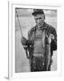 Fisherman Lauri Rapala, Who Handmakes Fishing Lures, with a Fish He Caught-null-Framed Photographic Print