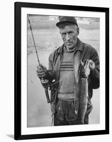 Fisherman Lauri Rapala, Who Handmakes Fishing Lures, with a Fish He Caught-null-Framed Photographic Print