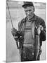 Fisherman Lauri Rapala, Who Handmakes Fishing Lures, with a Fish He Caught-null-Mounted Photographic Print