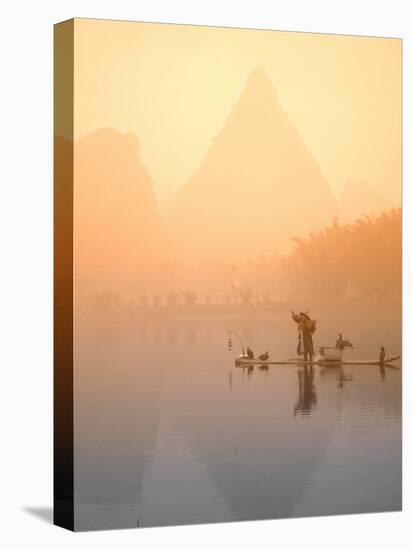 Fisherman on Bamboo Raft in Early Morning Mist, Li River, China-Keren Su-Stretched Canvas