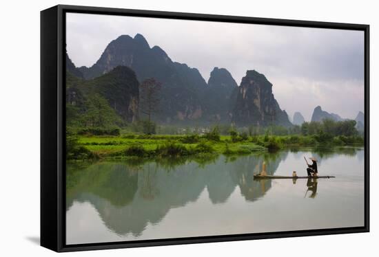 Fisherman on bamboo raft on Mingshi River at sunset, Mingshi, Guangxi Province, China-Keren Su-Framed Stretched Canvas