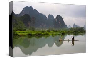 Fisherman on bamboo raft on Mingshi River at sunset, Mingshi, Guangxi Province, China-Keren Su-Stretched Canvas