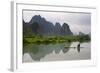 Fisherman on bamboo raft on Mingshi River at sunset, Mingshi, Guangxi Province, China-Keren Su-Framed Photographic Print