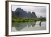 Fisherman on bamboo raft on Mingshi River at sunset, Mingshi, Guangxi Province, China-Keren Su-Framed Photographic Print