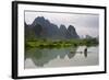 Fisherman on bamboo raft on Mingshi River at sunset, Mingshi, Guangxi Province, China-Keren Su-Framed Photographic Print