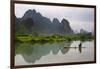 Fisherman on bamboo raft on Mingshi River at sunset, Mingshi, Guangxi Province, China-Keren Su-Framed Photographic Print