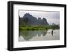 Fisherman on bamboo raft on Mingshi River at sunset, Mingshi, Guangxi Province, China-Keren Su-Framed Premium Photographic Print