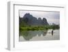 Fisherman on bamboo raft on Mingshi River at sunset, Mingshi, Guangxi Province, China-Keren Su-Framed Premium Photographic Print