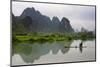 Fisherman on bamboo raft on Mingshi River at sunset, Mingshi, Guangxi Province, China-Keren Su-Mounted Premium Photographic Print