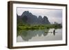 Fisherman on bamboo raft on Mingshi River at sunset, Mingshi, Guangxi Province, China-Keren Su-Framed Photographic Print