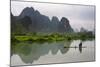 Fisherman on bamboo raft on Mingshi River at sunset, Mingshi, Guangxi Province, China-Keren Su-Mounted Photographic Print