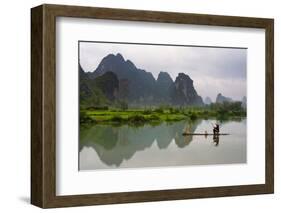 Fisherman on bamboo raft on Mingshi River at sunset, Mingshi, Guangxi Province, China-Keren Su-Framed Photographic Print