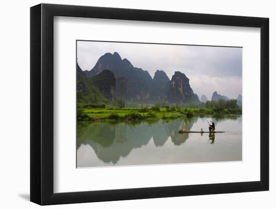 Fisherman on bamboo raft on Mingshi River at sunset, Mingshi, Guangxi Province, China-Keren Su-Framed Photographic Print