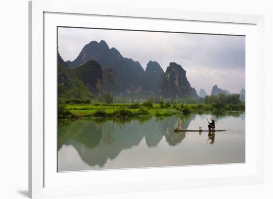 Fisherman on bamboo raft on Mingshi River at sunset, Mingshi, Guangxi Province, China-Keren Su-Framed Photographic Print
