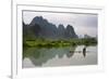 Fisherman on bamboo raft on Mingshi River at sunset, Mingshi, Guangxi Province, China-Keren Su-Framed Photographic Print