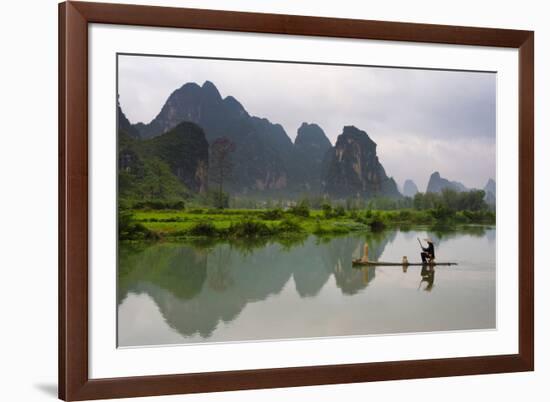 Fisherman on bamboo raft on Mingshi River at sunset, Mingshi, Guangxi Province, China-Keren Su-Framed Photographic Print