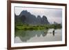 Fisherman on bamboo raft on Mingshi River at sunset, Mingshi, Guangxi Province, China-Keren Su-Framed Photographic Print