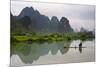 Fisherman on bamboo raft on Mingshi River at sunset, Mingshi, Guangxi Province, China-Keren Su-Mounted Photographic Print