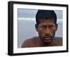 Fisherman Rests While Moving a Traditional Fishing Boat to the Sea at the Colva Beach in Goa, India-null-Framed Photographic Print