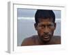 Fisherman Rests While Moving a Traditional Fishing Boat to the Sea at the Colva Beach in Goa, India-null-Framed Photographic Print