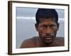 Fisherman Rests While Moving a Traditional Fishing Boat to the Sea at the Colva Beach in Goa, India-null-Framed Photographic Print