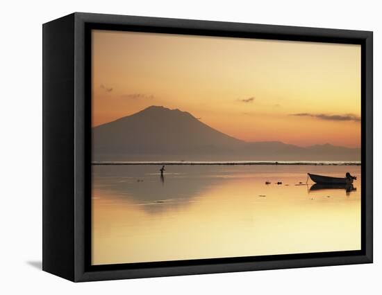 Fisherman Standing in Sea with Mount Agung in the Background, Sanur, Bali, Indonesia-Ian Trower-Framed Stretched Canvas