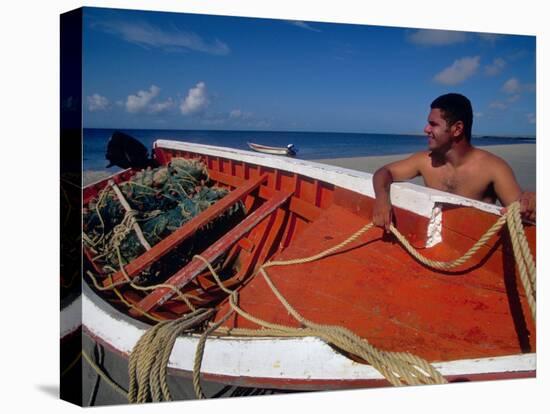 Fisherman Tends His Boat on the Beach, Isla Margarita, Venezuela-Greg Johnston-Stretched Canvas