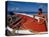 Fisherman Tends His Boat on the Beach, Isla Margarita, Venezuela-Greg Johnston-Stretched Canvas