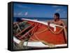 Fisherman Tends His Boat on the Beach, Isla Margarita, Venezuela-Greg Johnston-Framed Stretched Canvas