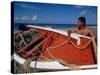 Fisherman Tends His Boat on the Beach, Isla Margarita, Venezuela-Greg Johnston-Stretched Canvas