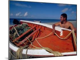 Fisherman Tends His Boat on the Beach, Isla Margarita, Venezuela-Greg Johnston-Mounted Premium Photographic Print