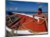 Fisherman Tends His Boat on the Beach, Isla Margarita, Venezuela-Greg Johnston-Mounted Photographic Print