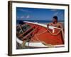 Fisherman Tends His Boat on the Beach, Isla Margarita, Venezuela-Greg Johnston-Framed Photographic Print